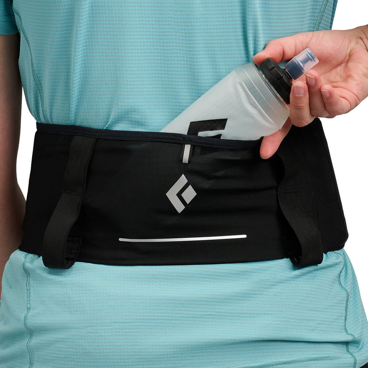 Black, back pocket with soft flask being inserted