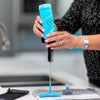 Bottle being put on drying on brush as drying stand