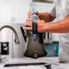 Using the bristle brush to clean a reservoir (2)