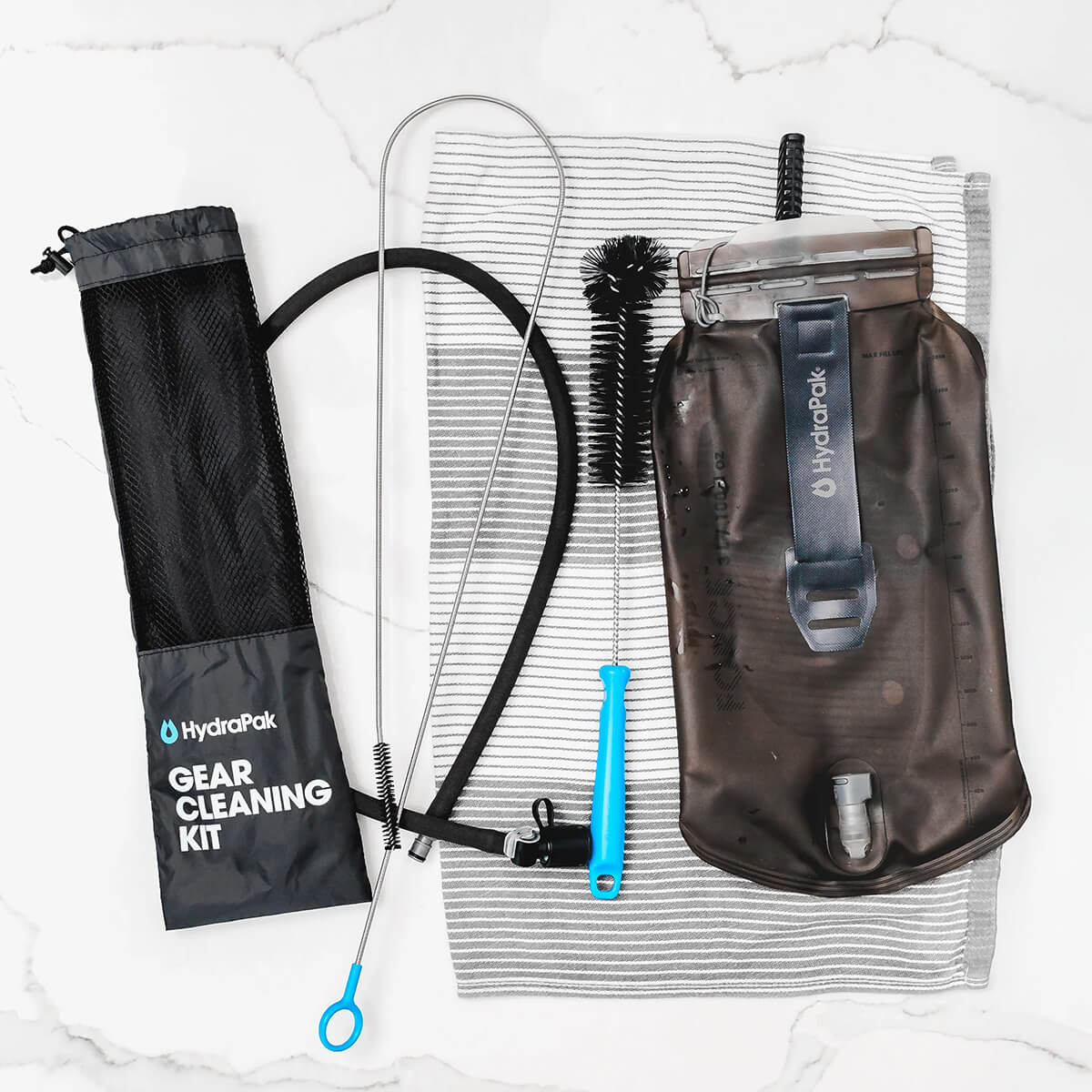 Kit laid out to dry on a tea towel with a reservoir 