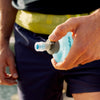 Lever lock cap being opened with a thumb