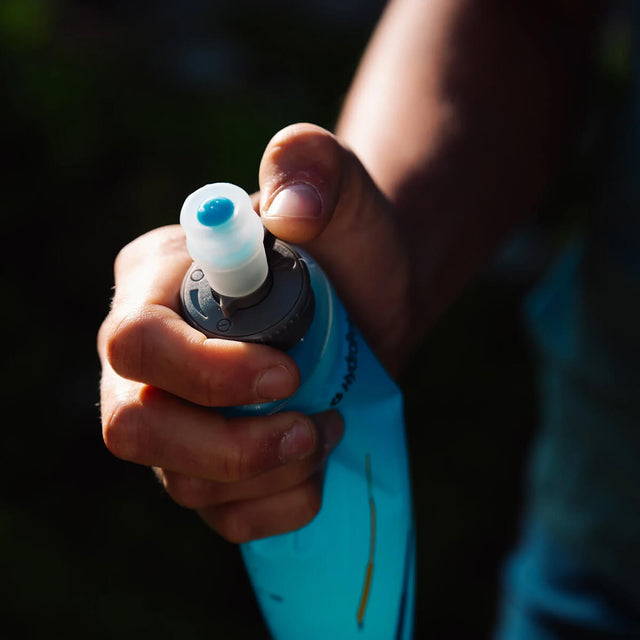 Lever lock cap being closed with a thumb