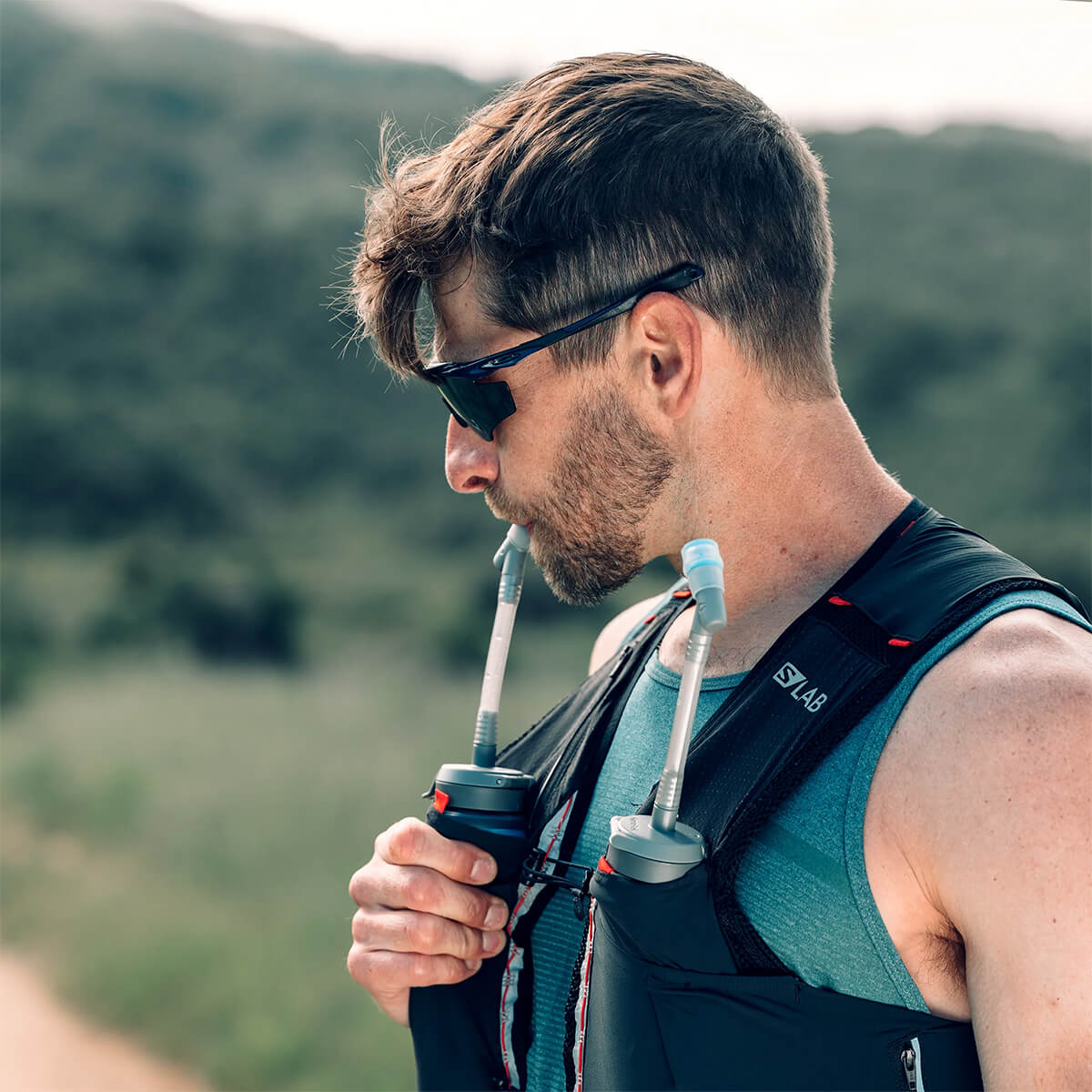 Close up of someone drinking out of the Adapter