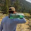 Sage Green, being carried over shoulder