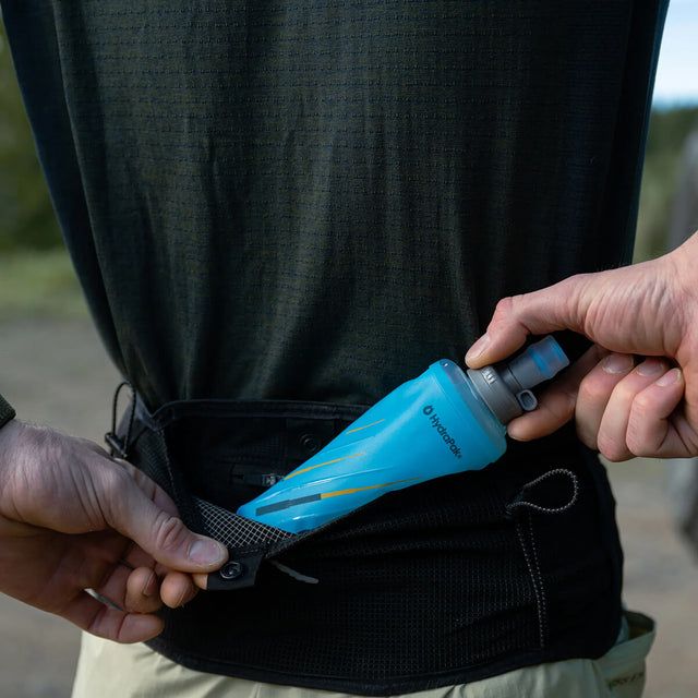 Being inserted into the back pocket of a run belt
