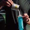 Cap open and powder mix being poured in