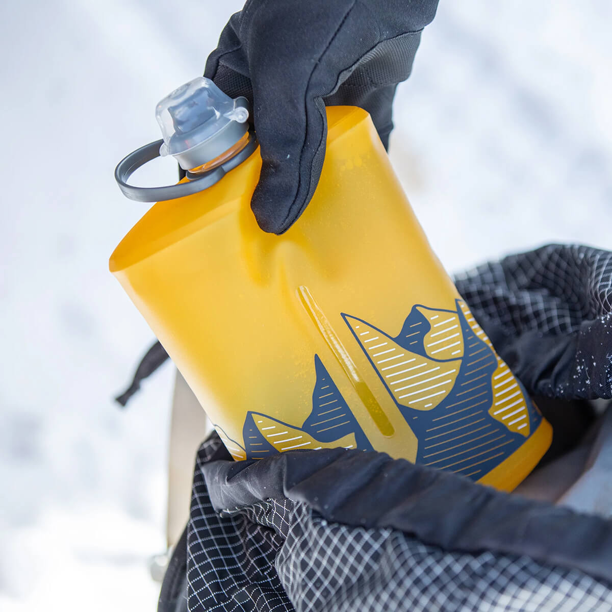 Golden Yellow being stowed in pack in a snowy environment