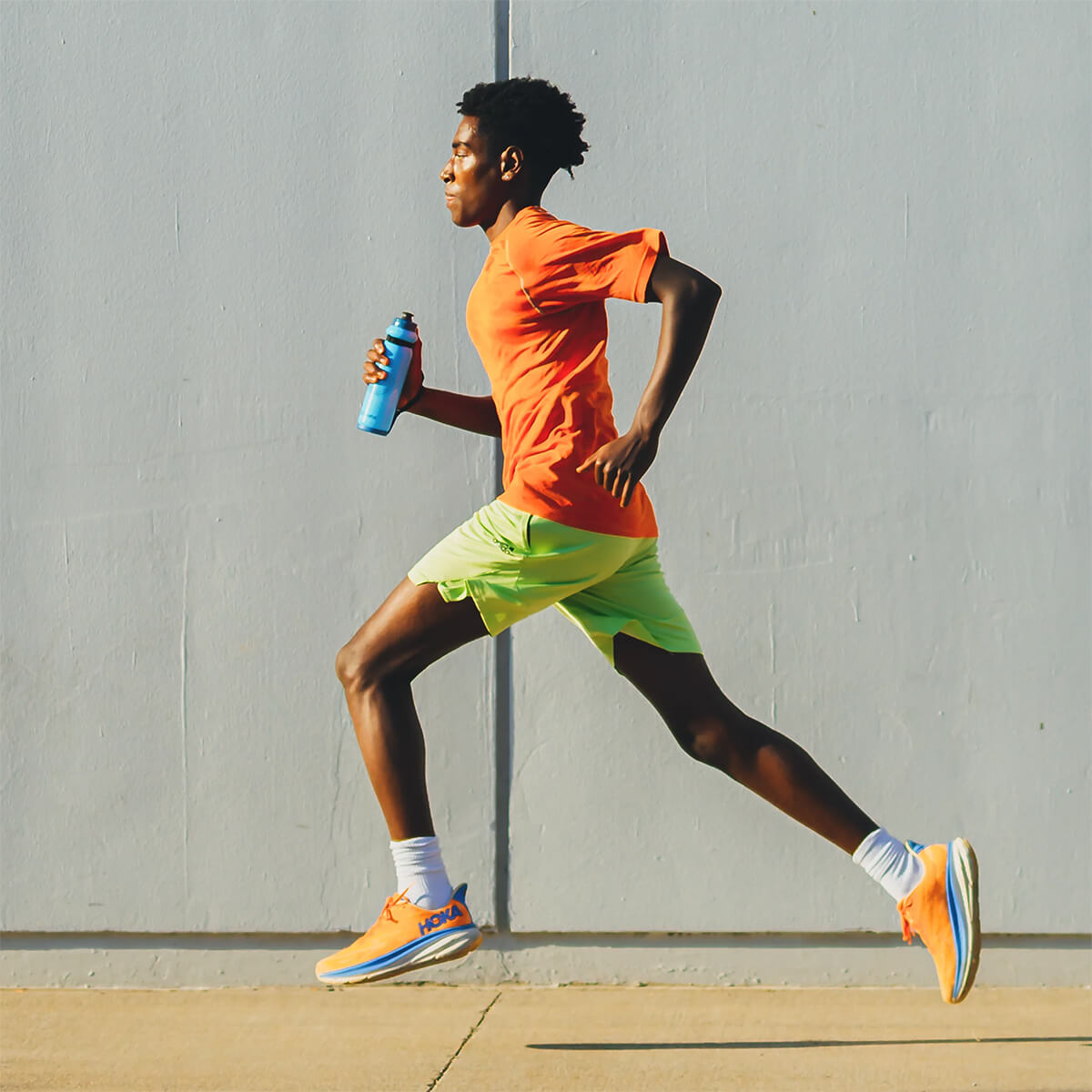Blue, held by runner in urban environment