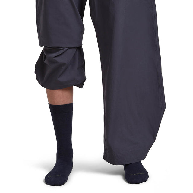 Midnight Navy/Dk Loden on model, front view, one trouser leg up, one down