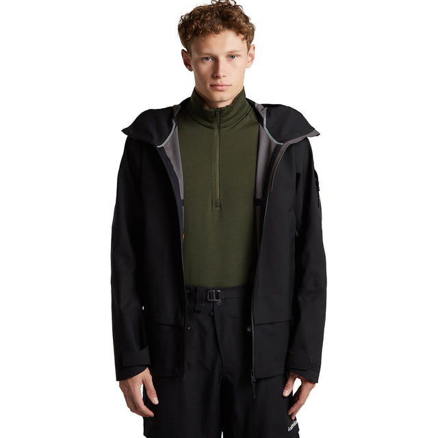 Worn under open rain jacket