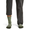 Lichen/Dk Loden on model, front view, one trouser leg up, one down
