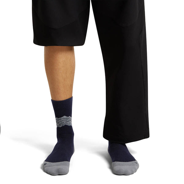 Midnight Navy/Alloy/Snow on model, front view, one trouser leg up, one down