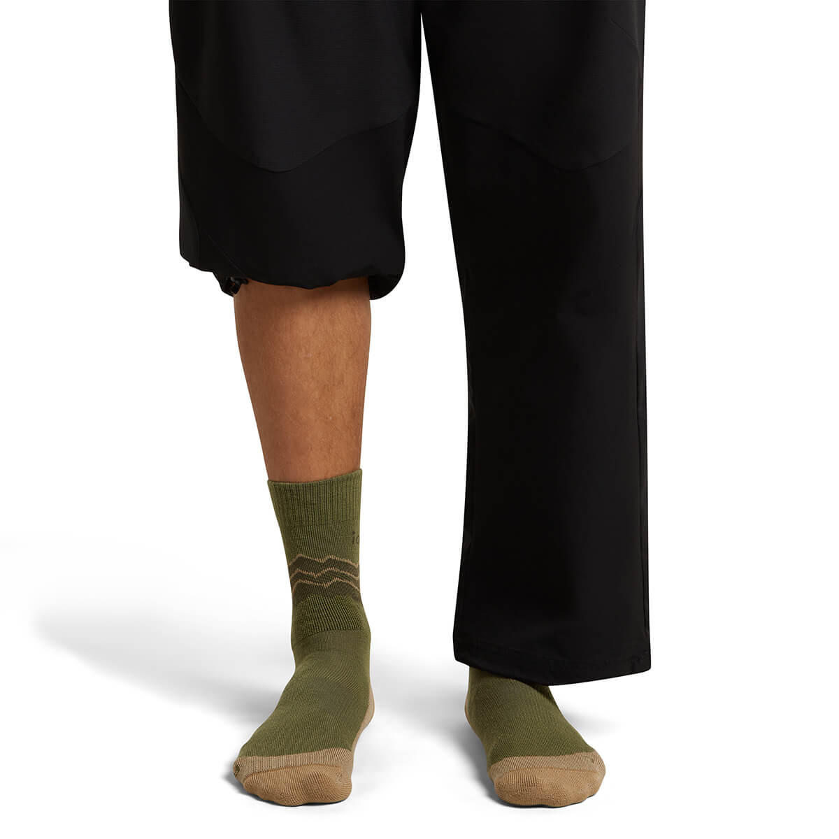 Sphagnum/Cumin/Dk Loden on model, front view, one trouser leg up, one down