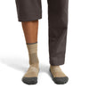 Cumin/Obsidian on model, front view, one trouser leg up, one down