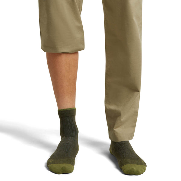 Dk Loden/Sphagnum on model, front view, one trouser leg up, one down