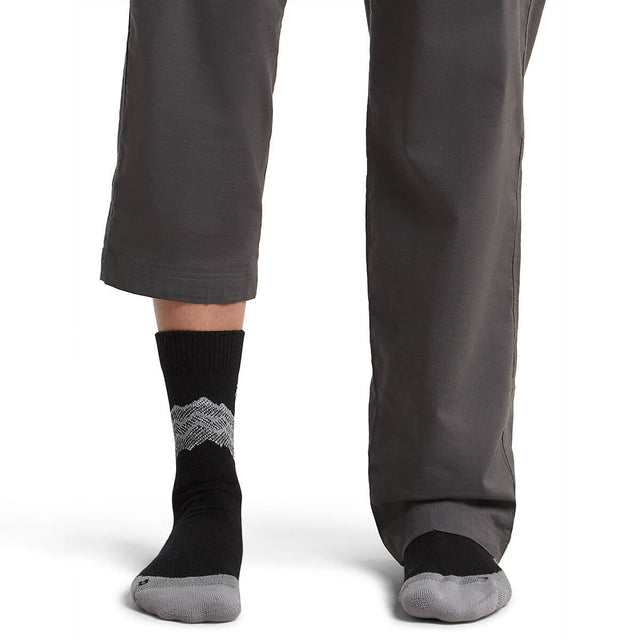 Black/Alloy/Snow on model, front view, one trouser leg up, one down