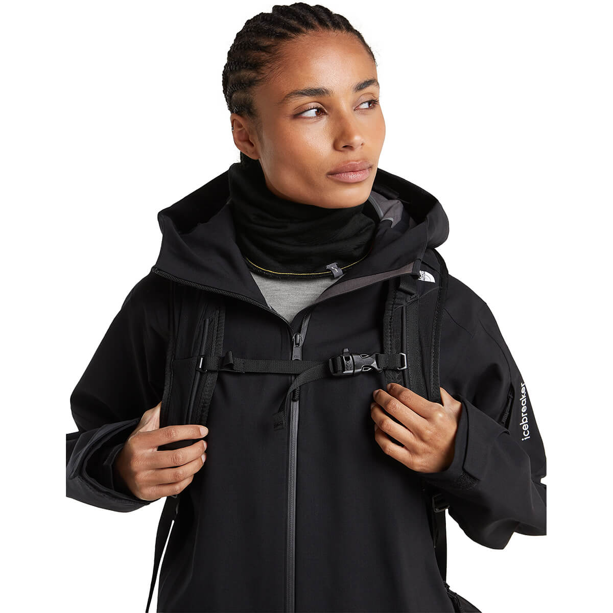 Black/Obsidian reversed, worn with jacket and pack by female model, front view