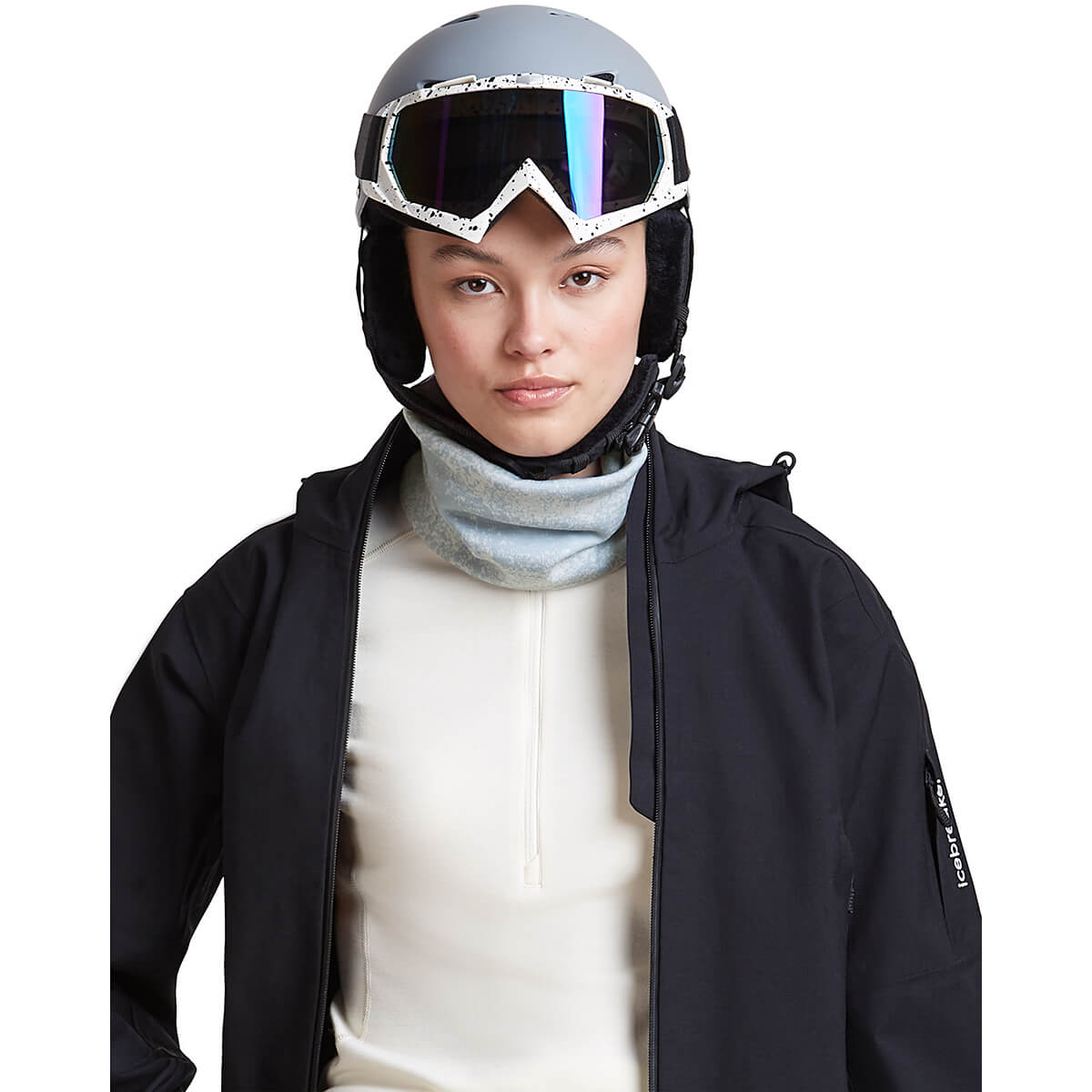 Snow/Zinc Blue, on female model wearing a helmet and jacket, front view