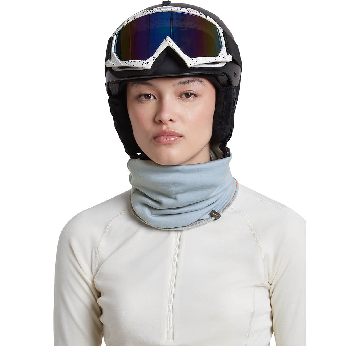 Snow/Zinc Blue reversed, on female model with helmet on, front view