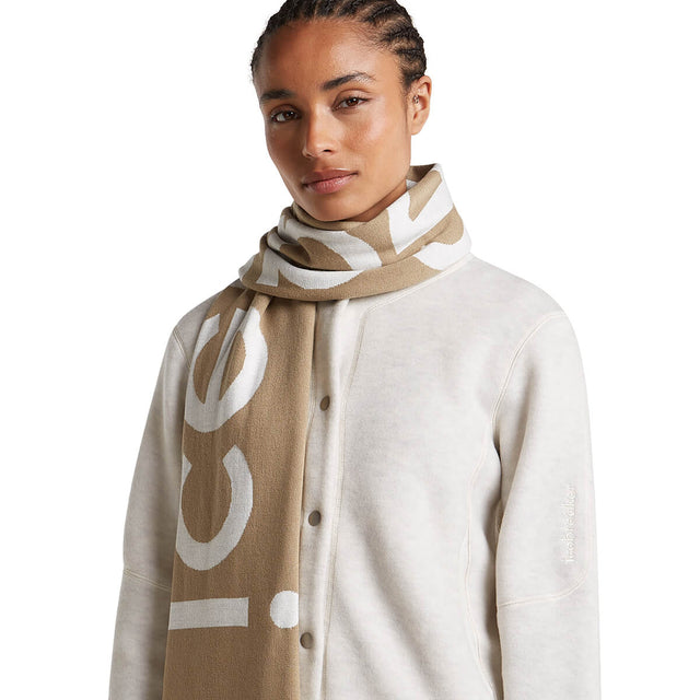 Ecru Heather/Cumin worn by female model, Cumin side out, one end slung over shoulder