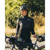 Black, worn in the outdoors next to a bike