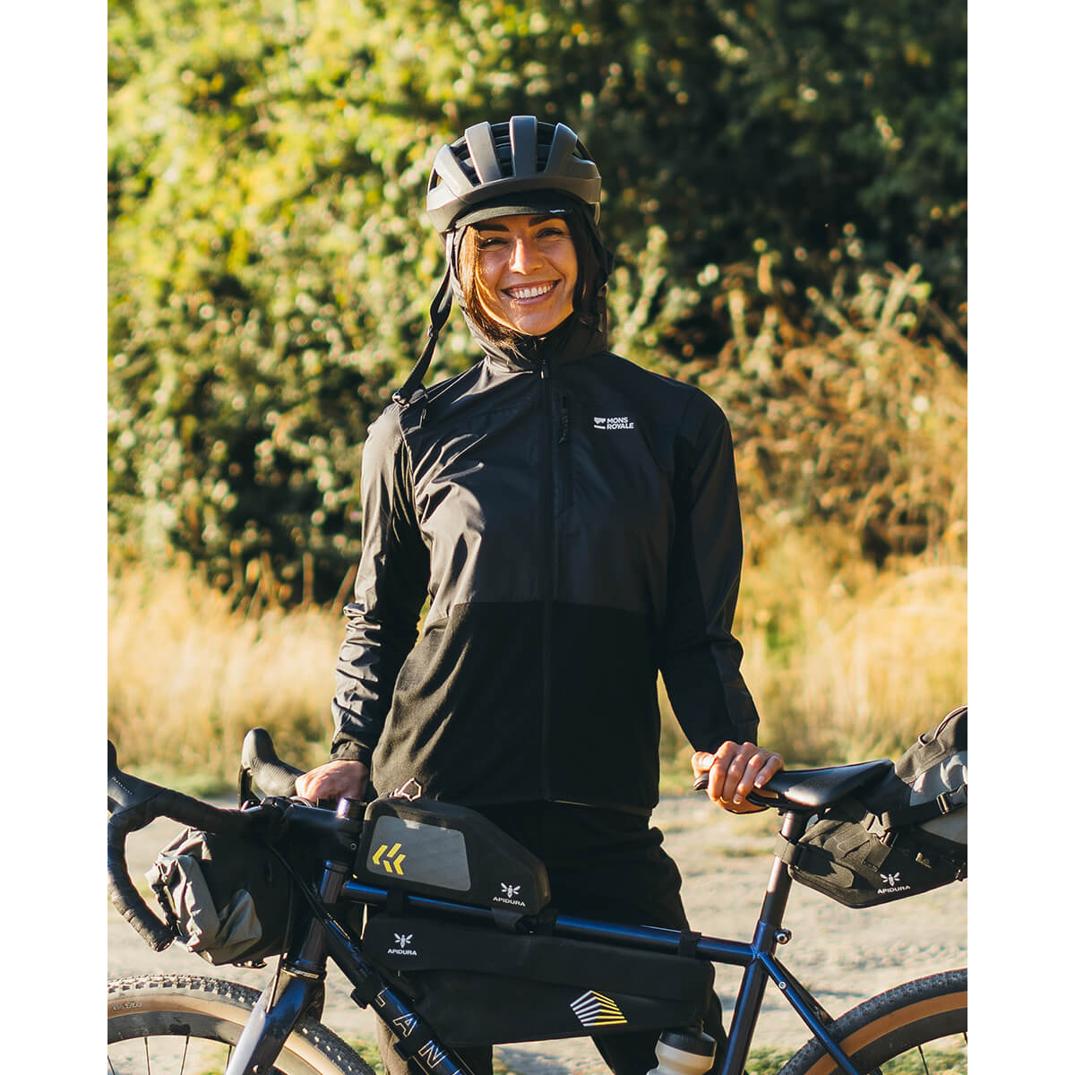 Black, worn in the outdoors next to a bike