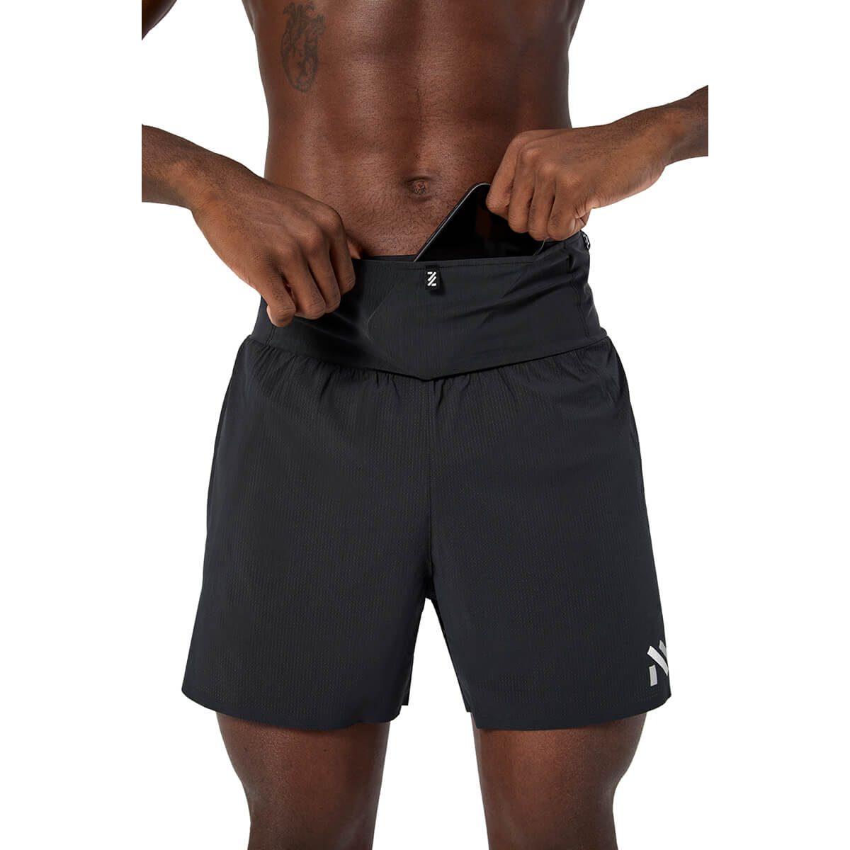 Black, front waist pocket in use with phone