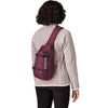Berry Fig carried crossbody on back by female model