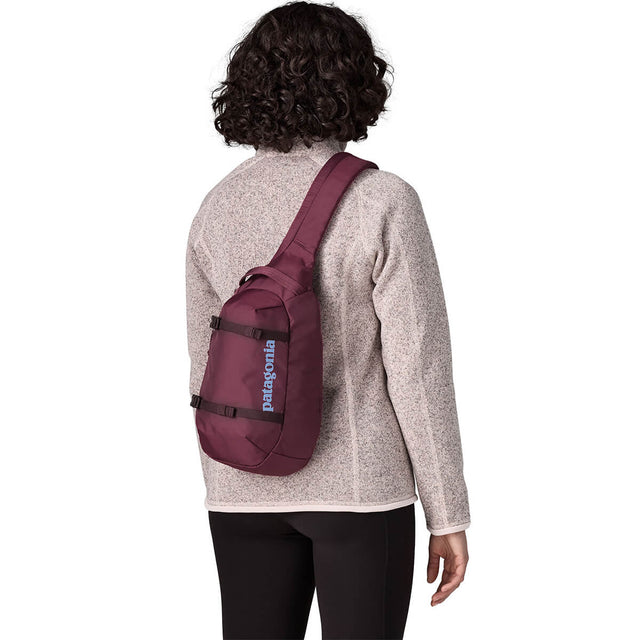 Berry Fig carried crossbody on back by female model