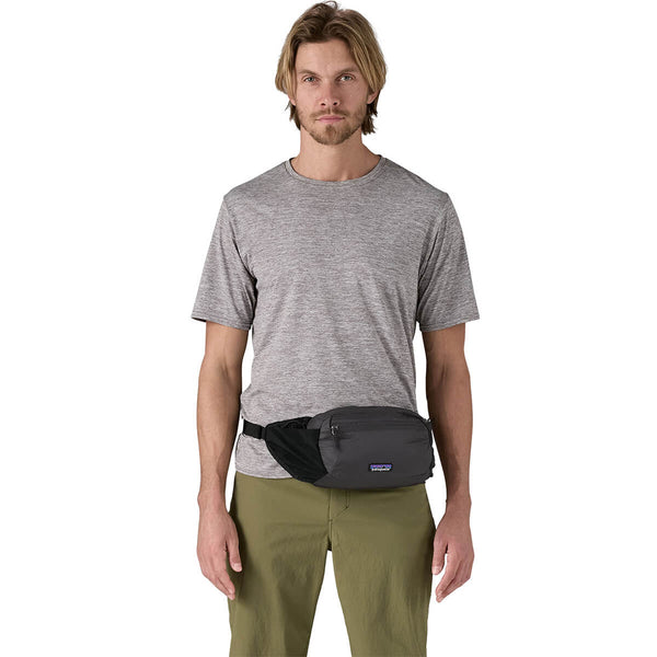 Black carried as hip pack at front by male model