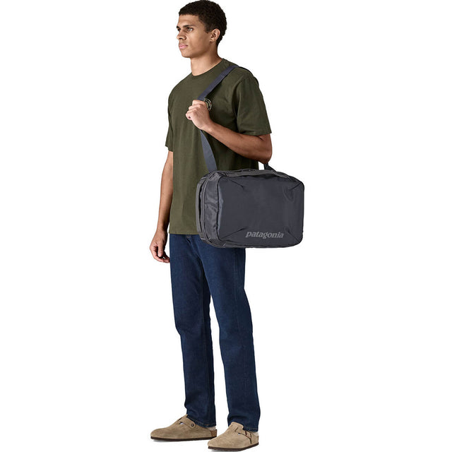 Smolder Blue carried  as satchel by male model