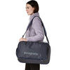 Smolder Blue w/Forge Grey carried as satchel by female model