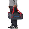 Smolder Blue w/Amanita Red carried by handles as duffel
