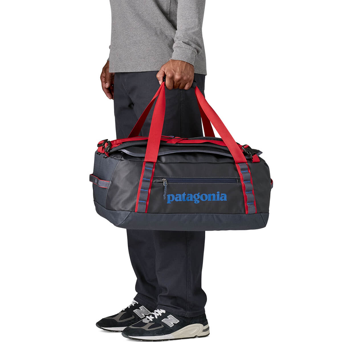 Smolder Blue w/Amanita Red carried by handles as duffel