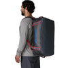 Smolder Blue w/Amanita Red carried by male model as backpack