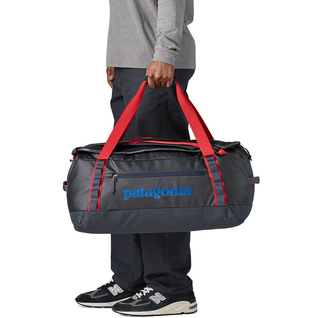 Smolder Blue w/Amanita Red carried by handles as duffel