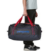 Smolder Blue w/Amanita Red carried by handles as duffel