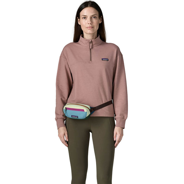 Patchwork/Snowmelt Blue worn at right front as hip pack by female model