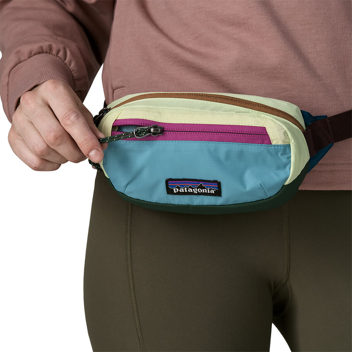 Patchwork/Snowmelt Blue worn as hip pack and closing zip