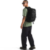Black, carried on back by male model