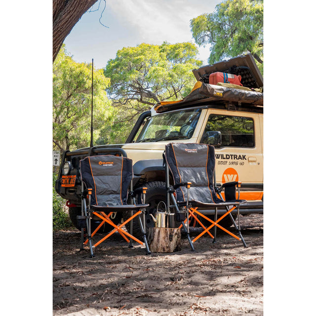 Side by side with the Cheynes Solid Arm Chair High Back in the outdoors