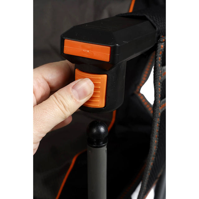 3/4 front of armrest showing wine-glass holder stowed and clip underneath being used to take the arm off the frame 