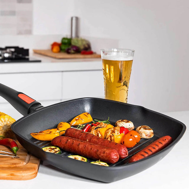 With sausages and veggies on a home kitchen bench