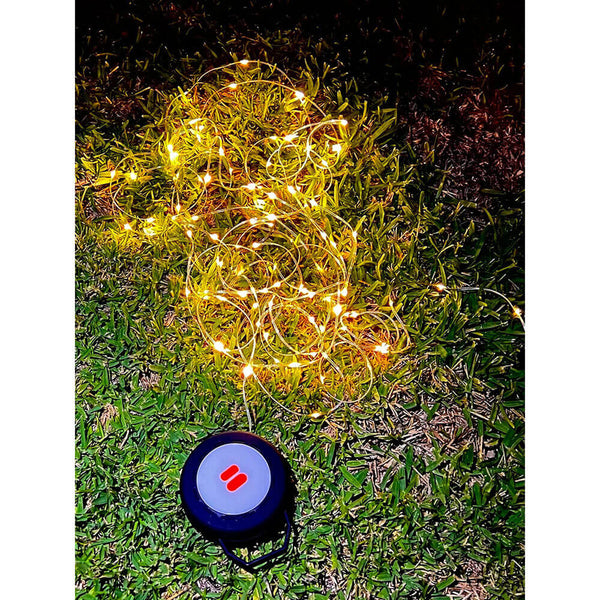 String light lit, lantern not, on grass surface