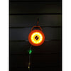 Amber-lit lantern hanging from a hook with lit string lights dangling down