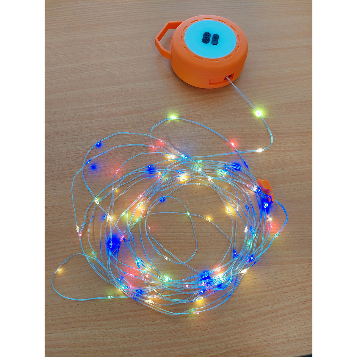 On a table, string lights out and lit