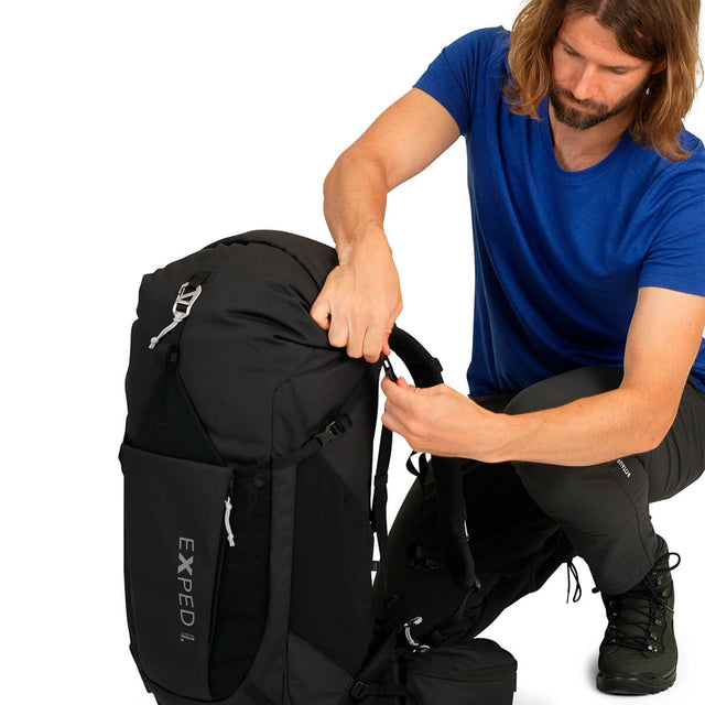 Black, tying down the roll top with top pocket removed