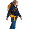 On model with trekking poles attached to harness