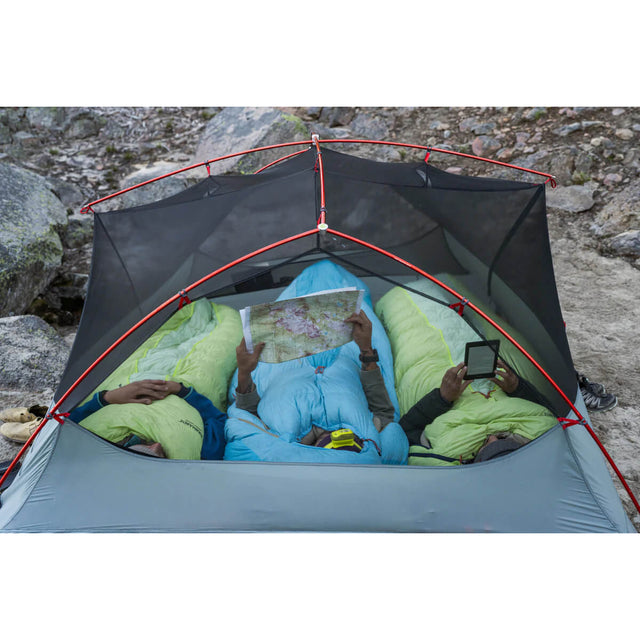 In the field, canopy only, showing 3 people in sleeping bags (photo: Barkman)