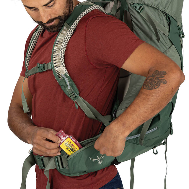 Pine Leaf Green left hipbelt pocket in use
